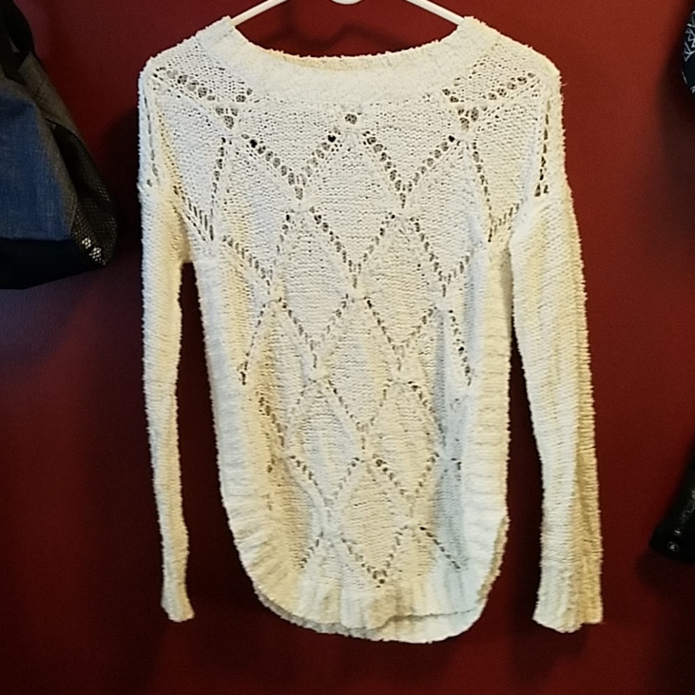 Maurice's white sweater